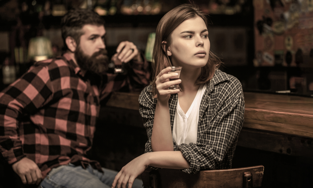 young woman worried in a bar